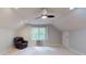 Comfortable bonus room features a black leather chair and an AC unit at 2329 Wedgewood Dr, Matthews, NC 28104