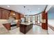 Spacious kitchen featuring custom cabinets, an island with granite countertop, and modern stainless steel appliances at 2329 Wedgewood Dr, Matthews, NC 28104