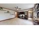 Cozy living room features warm wood trim, black floating shelves, and a door to another room at 2329 Wedgewood Dr, Matthews, NC 28104