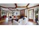 The open living room features wood trim, hardwood floors, a fireplace and multiple windows at 2329 Wedgewood Dr, Matthews, NC 28104