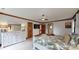 Tranquil main bedroom with white dresser, wood trim, ceiling fan, and view of ensuite bathroom at 2329 Wedgewood Dr, Matthews, NC 28104