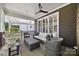 Relaxing back porch with comfortable seating, ceiling fan, and view of the outdoors at 2311 Club Rd, Charlotte, NC 28205