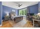 Comfortable bedroom with a large bed, a dedicated workspace, and natural light at 2311 Club Rd, Charlotte, NC 28205