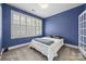 Bedroom in blue, has large window with shutters and comfortable bed at 2311 Club Rd, Charlotte, NC 28205