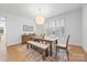 Bright dining room with natural light, modern chandelier, and stylish furniture at 2311 Club Rd, Charlotte, NC 28205