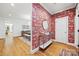 Elegant foyer with hardwood floors, decorative wallpaper, and access to the dining area at 2311 Club Rd, Charlotte, NC 28205