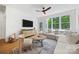Cozy living room featuring a modern TV console, and an L-shaped couch at 2311 Club Rd, Charlotte, NC 28205