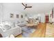Bright open-concept living space featuring a kitchen and cozy living room with ample seating at 2311 Club Rd, Charlotte, NC 28205