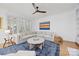Comfortable living room with a large sectional sofa, modern fan, and stylish decor at 2311 Club Rd, Charlotte, NC 28205