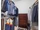 Organized walk-in closet with shelving, drawers, rods for hanging clothes, and a dresser at 2311 Club Rd, Charlotte, NC 28205