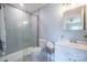 Tiled bathroom features a walk-in shower with glass door and modern fixtures at 233 E Waterlynn Rd # B, Mooresville, NC 28117