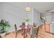 Dining room area with hardwood floors and a round table with wicker chairs at 233 E Waterlynn Rd # B, Mooresville, NC 28117