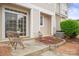 Outdoor patio with chairs, a small table, and landscaped flower beds at 233 E Waterlynn Rd # B, Mooresville, NC 28117