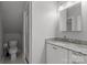Bathroom with granite countertop vanity, toilet, and shower with glass enclosure at 2556 Howerton Ct, Charlotte, NC 28270