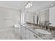 Elegant bathroom featuring double sinks, granite countertops, soaking tub, and glass-enclosed shower at 2556 Howerton Ct, Charlotte, NC 28270