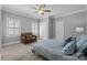 This bedroom features a ceiling fan, large windows with plantation shutters, and plenty of closet space at 2556 Howerton Ct, Charlotte, NC 28270