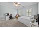Bedroom featuring a ceiling fan, carpet, and two windows allowing natural light at 2556 Howerton Ct, Charlotte, NC 28270