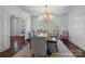 Elegant dining room featuring natural light, beautiful wainscoting, and stylish furnishings at 2556 Howerton Ct, Charlotte, NC 28270