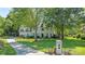 Beautiful two-story home with a manicured lawn, mature trees, and a charming front entrance at 2556 Howerton Ct, Charlotte, NC 28270