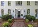 Inviting front entrance with a brick walkway, elegant door, and tasteful landscaping at 2556 Howerton Ct, Charlotte, NC 28270