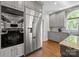 Kitchen featuring stainless steel refrigerator, granite countertops, and plenty of cabinet space at 2556 Howerton Ct, Charlotte, NC 28270