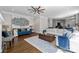 Spacious living room with hardwood floors and neutral walls that opens to kitchen and breakfast area at 2556 Howerton Ct, Charlotte, NC 28270