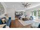 Open living space with hardwood floors adjacent to kitchen and dining area at 2556 Howerton Ct, Charlotte, NC 28270