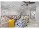 Large living room featuring a ceiling fan, large sectional sofa, and a projector with a screen at 2556 Howerton Ct, Charlotte, NC 28270