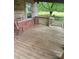 Cozy wooden deck with wooden rails and wooded plank flooring at 3063 Liledoun Rd, Taylorsville, NC 28681
