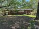 Quaint single story home with brick accents and covered wooden deck at 3063 Liledoun Rd, Taylorsville, NC 28681