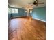 Inviting living room with beautiful hardwood floors, natural light and neutral color at 3063 Liledoun Rd, Taylorsville, NC 28681