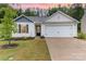 Charming home featuring white siding, a gray shingled roof, and an attached two-car garage at 3138 Maple Ridge Dr, Gastonia, NC 28052