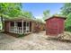 The backyard has a brick house, covered porch, and a storage shed at 3733 Manchester Dr, Charlotte, NC 28217