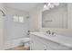 Bathroom featuring updated fixtures, subway tile, and white vanity offers a modern and functional space at 3733 Manchester Dr, Charlotte, NC 28217