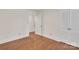 A bedroom with an open closet featuring hardwood floors and bright windows at 3733 Manchester Dr, Charlotte, NC 28217