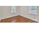 Cozy bedroom featuring bright windows and hardwood floors at 3733 Manchester Dr, Charlotte, NC 28217