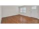 Cozy bedroom with hardwood floors, natural light, and a comfortable living space at 3733 Manchester Dr, Charlotte, NC 28217