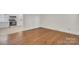 Open-concept living room features hardwood floors, natural light, and a seamless flow to the kitchen at 3733 Manchester Dr, Charlotte, NC 28217