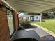 A covered back patio area leads to a landscaped back yard at 396 Pitts School Nw Rd, Concord, NC 28027