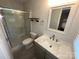 Bathroom featuring a shower, marble countertop and updated fixtures at 396 Pitts School Nw Rd, Concord, NC 28027