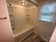 Clean bathroom featuring a tub with shower and built-in shelves at 396 Pitts School Nw Rd, Concord, NC 28027