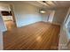 Bright dining room with wood floors and a modern chandelier at 396 Pitts School Nw Rd, Concord, NC 28027