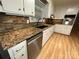 Up-close view of the kitchen, featuring stainless steel appliances and granite countertops at 396 Pitts School Nw Rd, Concord, NC 28027