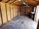 Shed interior featuring a workbench and plywood walls and floor at 396 Pitts School Nw Rd, Concord, NC 28027