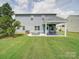 Spacious backyard with a covered patio and hot tub, perfect for outdoor entertaining and relaxation at 4008 Houndscroft Rd, Indian Trail, NC 28079