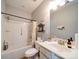 A functional bathroom featuring a bathtub with shower, toilet, and a vanity with ample counter space at 4008 Houndscroft Rd, Indian Trail, NC 28079