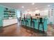 Bright and open kitchen featuring a breakfast bar, stainless steel appliances, and updated cabinetry at 4008 Houndscroft Rd, Indian Trail, NC 28079