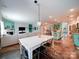 Open-concept living space with a spacious dining table, a fireplace and an adjoining kitchen at 4008 Houndscroft Rd, Indian Trail, NC 28079