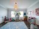 Bright playroom with a unique rug, shelving, and plenty of space for activities at 4008 Houndscroft Rd, Indian Trail, NC 28079