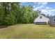 Large backyard with an above ground pool, a shed, and plenty of trees at 406 Brentwood Cir, Kannapolis, NC 28081